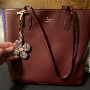 Kate Spade Burgundy Leather Top Zip Shoulder Purse/Flower  Charm, good condition